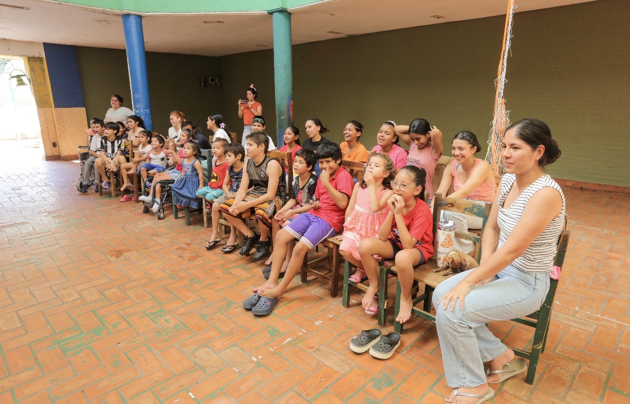 Children and families seated together during a Victory Legacy gathering in Paraguay
